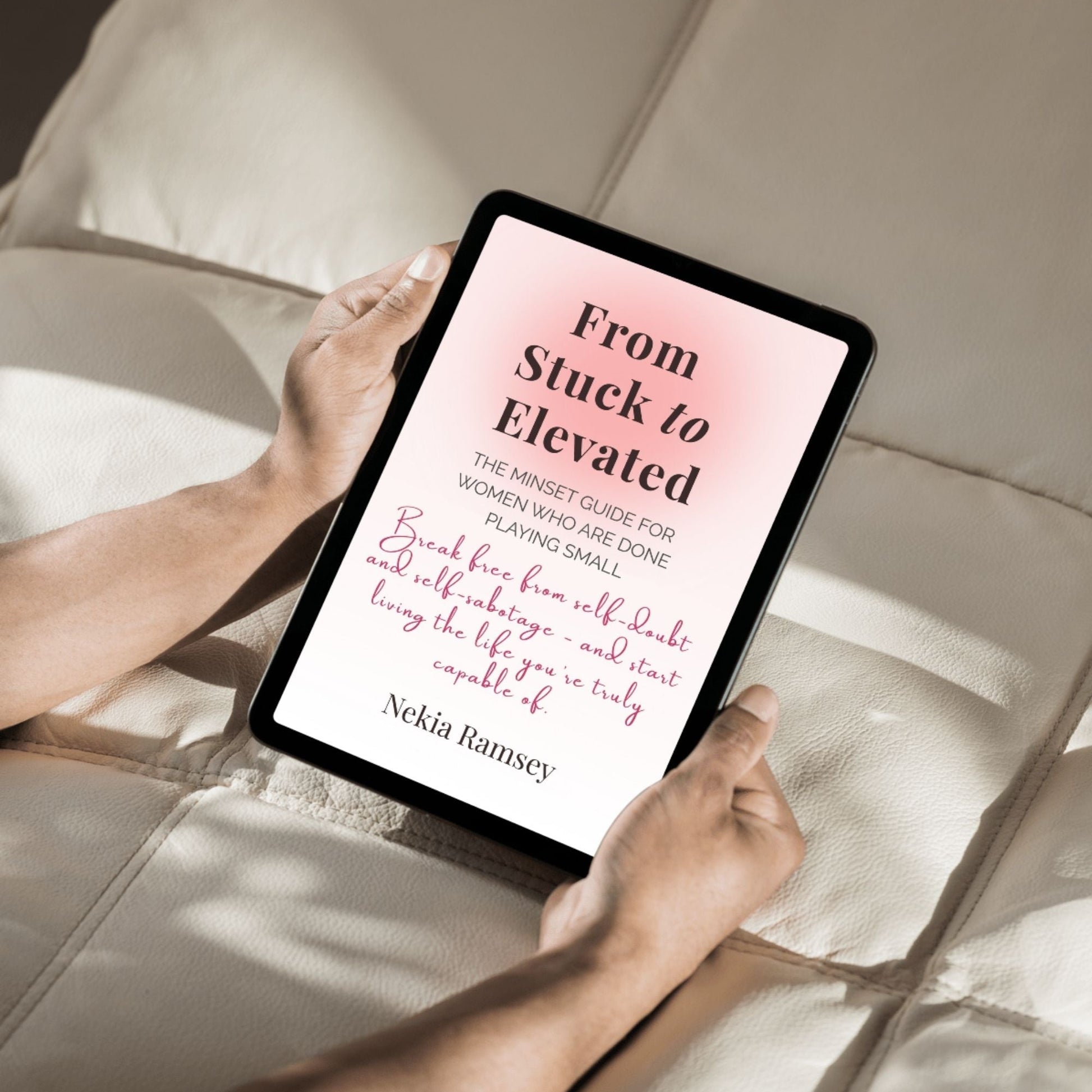 Digital mockup of the From Stuck to Elevated e-book displayed on a tablet being held over a pillow — a calming setup symbolizing growth and reflection.