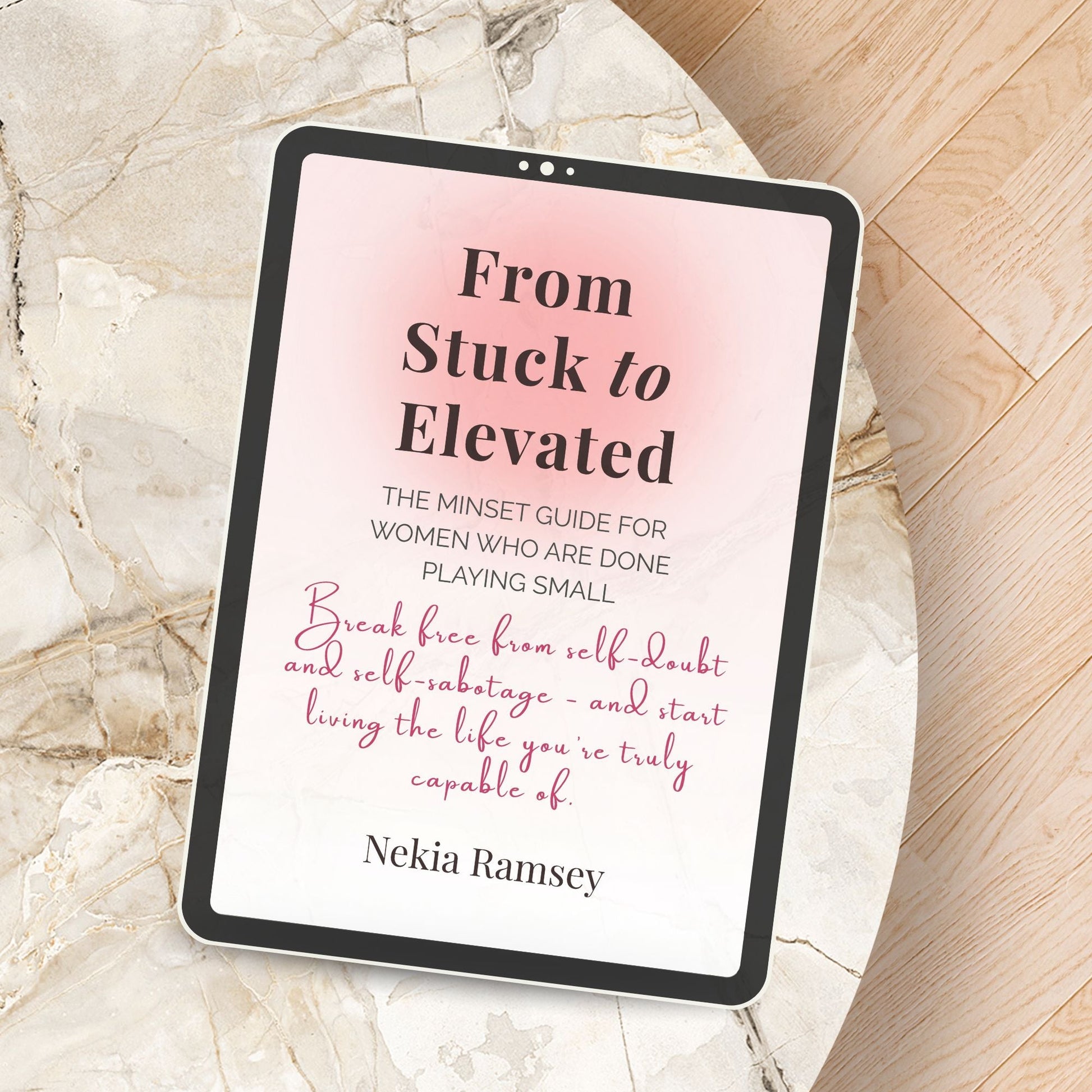 Digital mockup of the From Stuck to Elevated e-book displayed on a tablet laying on a coffee table — a calming setup symbolizing growth and reflection.
